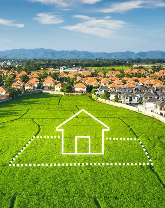 A green plot of land marked for future housing development.